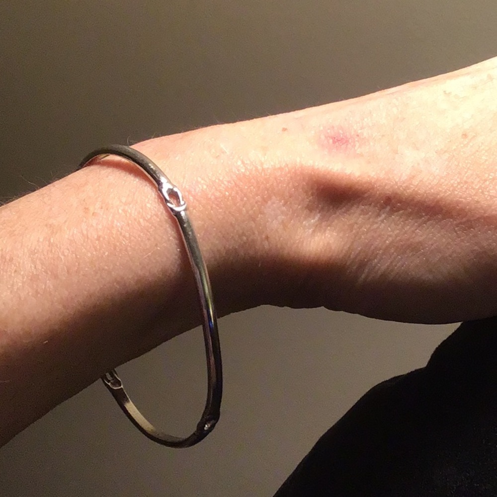 Silver tone Celtic knot bracelet by Monet.